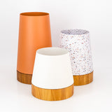 Round tapered steel planter pot plant. Iroko wood base, contemporary pot plant South Africa. Handmade in stainless steel for outdoor use