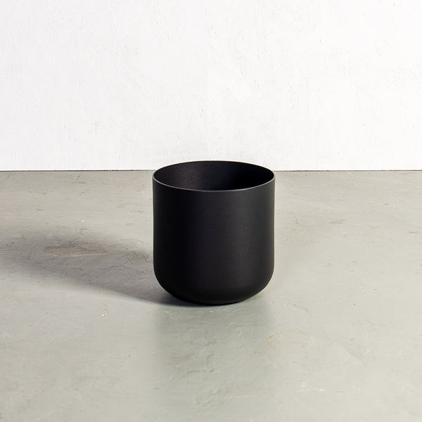 Plantr | small black round planter. Curved steel pot plant. Aluminium spun